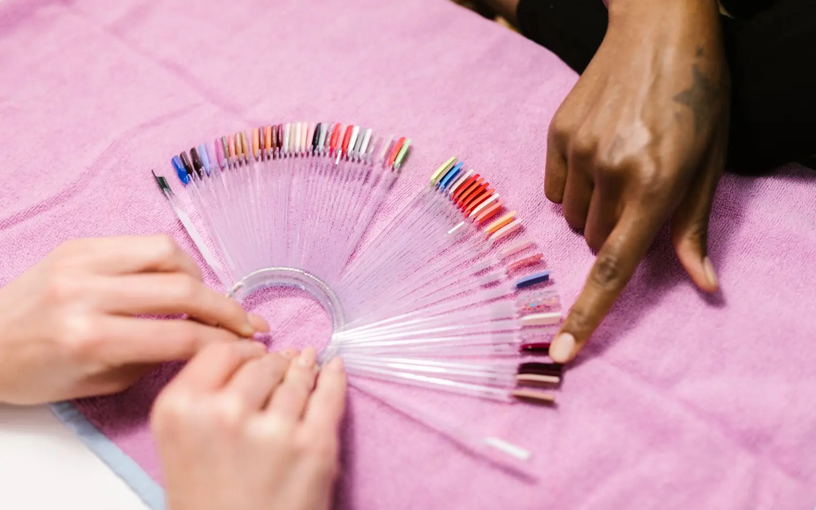 Choosing a shade from a nail polish swatch wheel