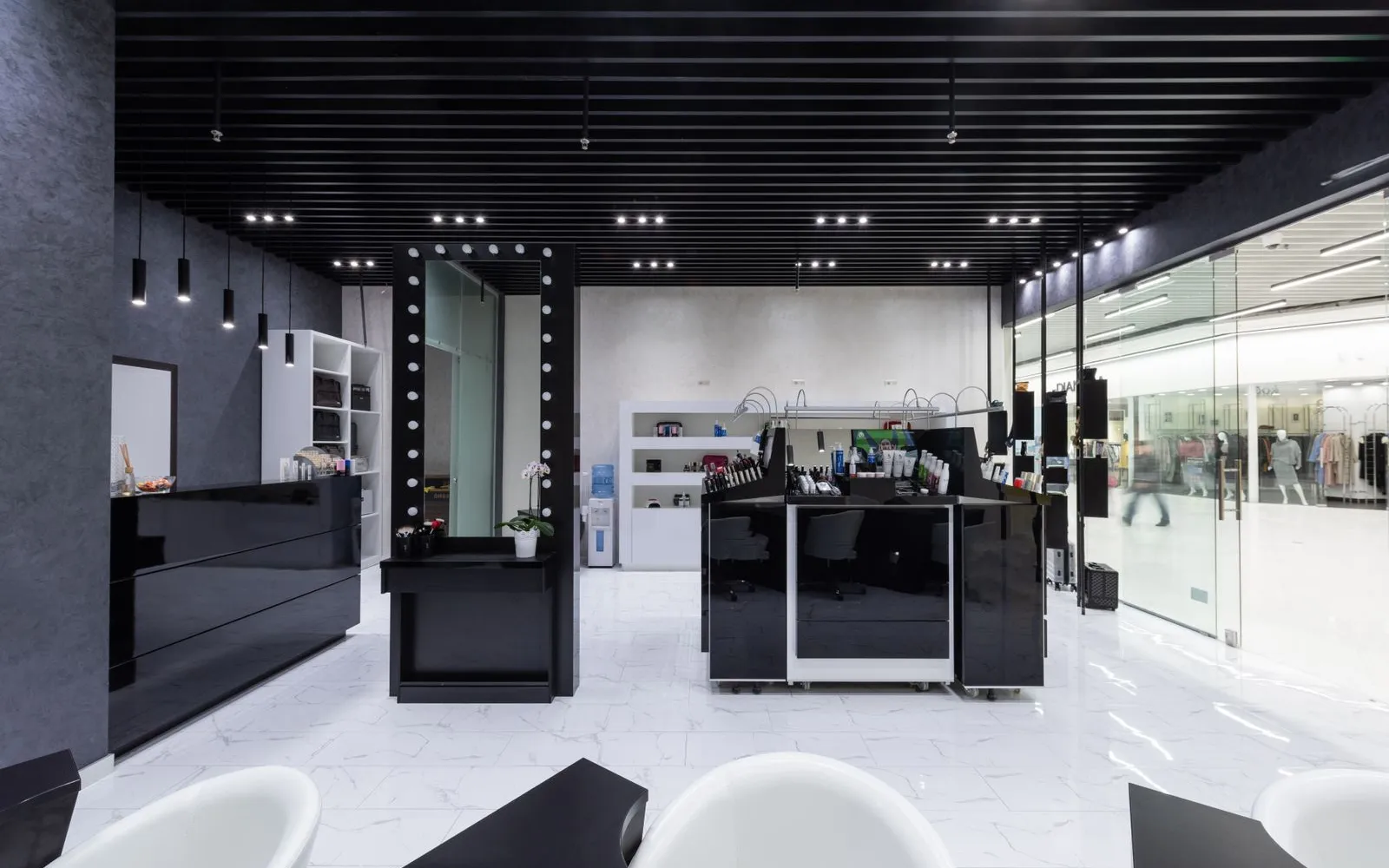 A modern salon with several manicure stations